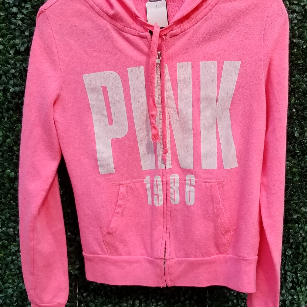 Pink zip up hoodie.